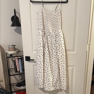 Smocked white polka dot mid length dress